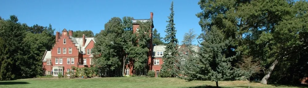 The monastery's main house, a red-brick 1881 mansion among trees